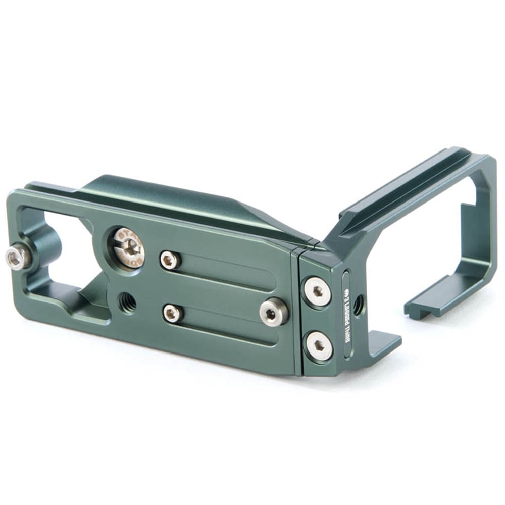 Green metal camera bracket on a white background