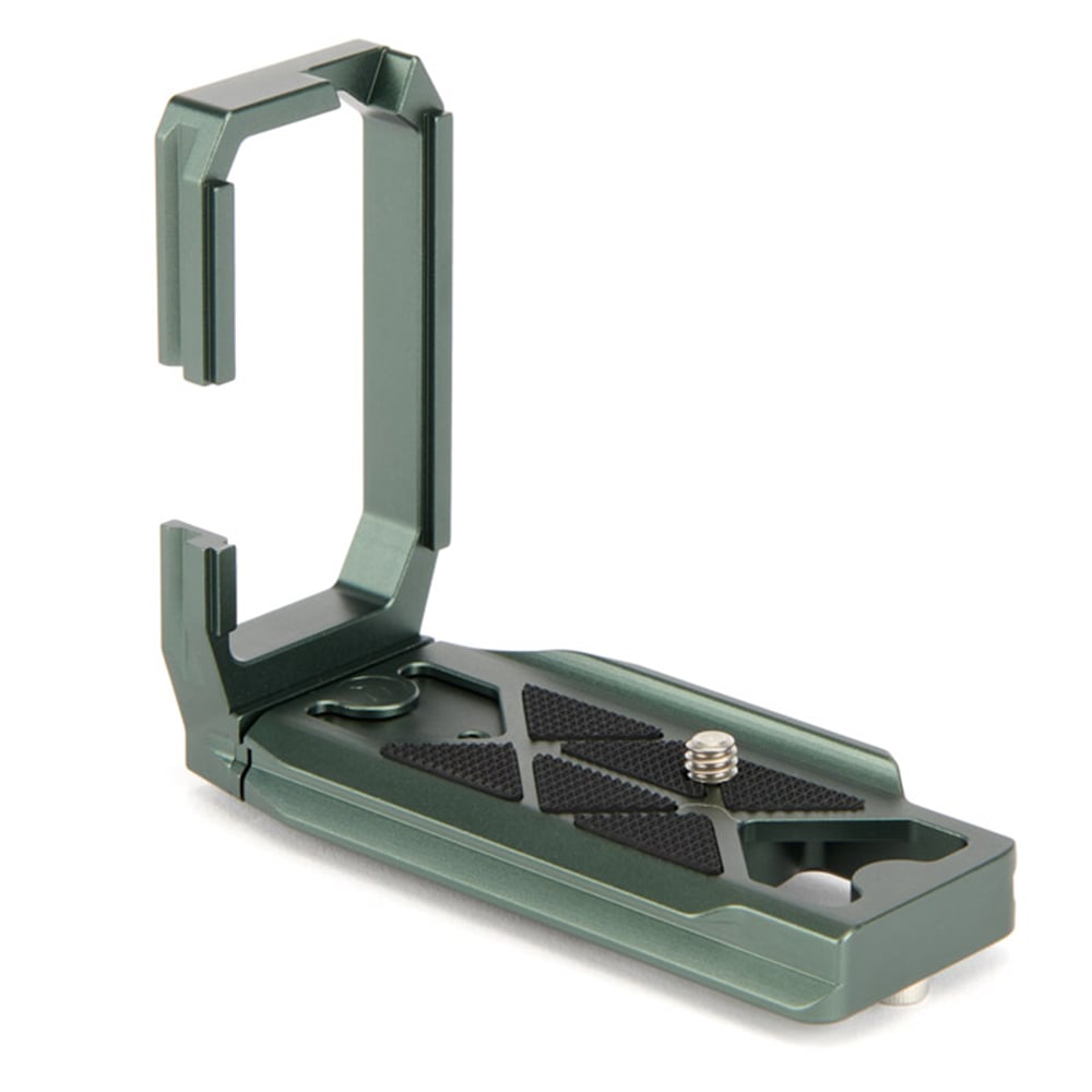 Green metal camera accessory on a white background