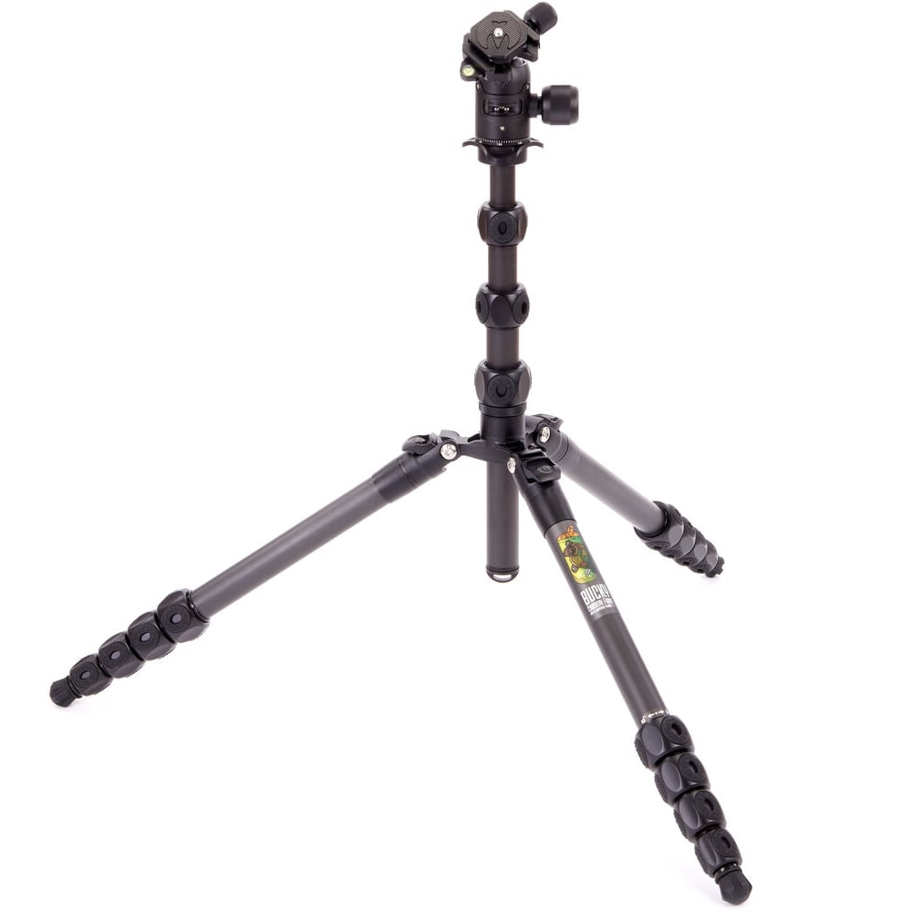 Black camera tripod on a white background
