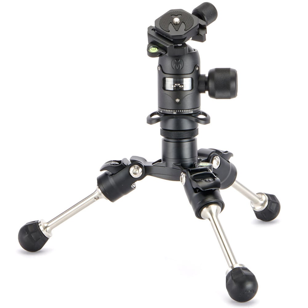 Camera tripod with ball head on a white background