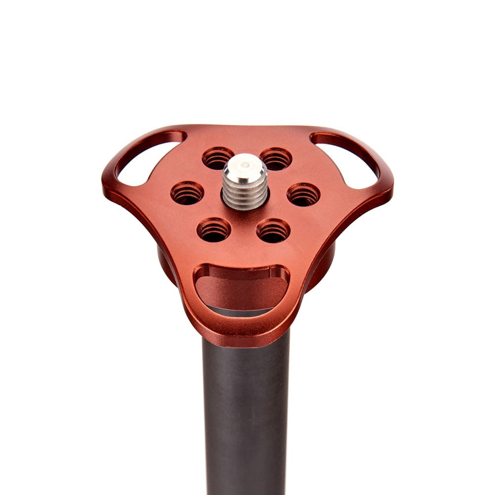 Red metal seat post with a black cylindrical section on a white background