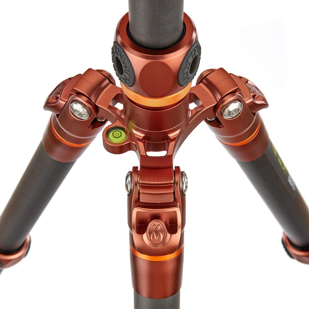 Close-up of a red and black tripod on a white background