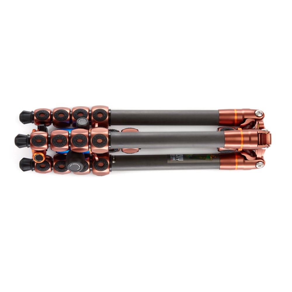 Camera tripod with black and copper accents on a white background