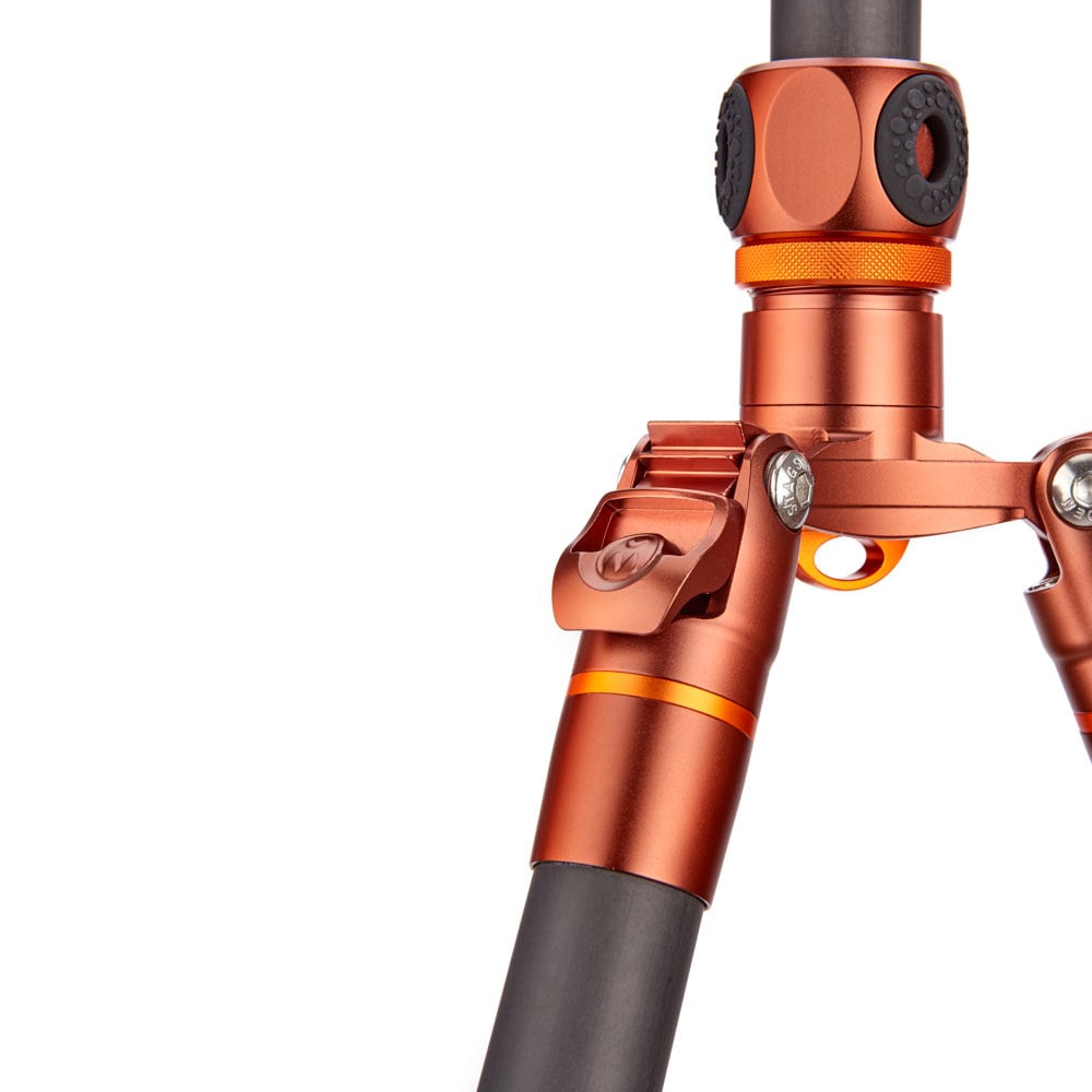 Close-up of an orange metal mechanical component on a white background