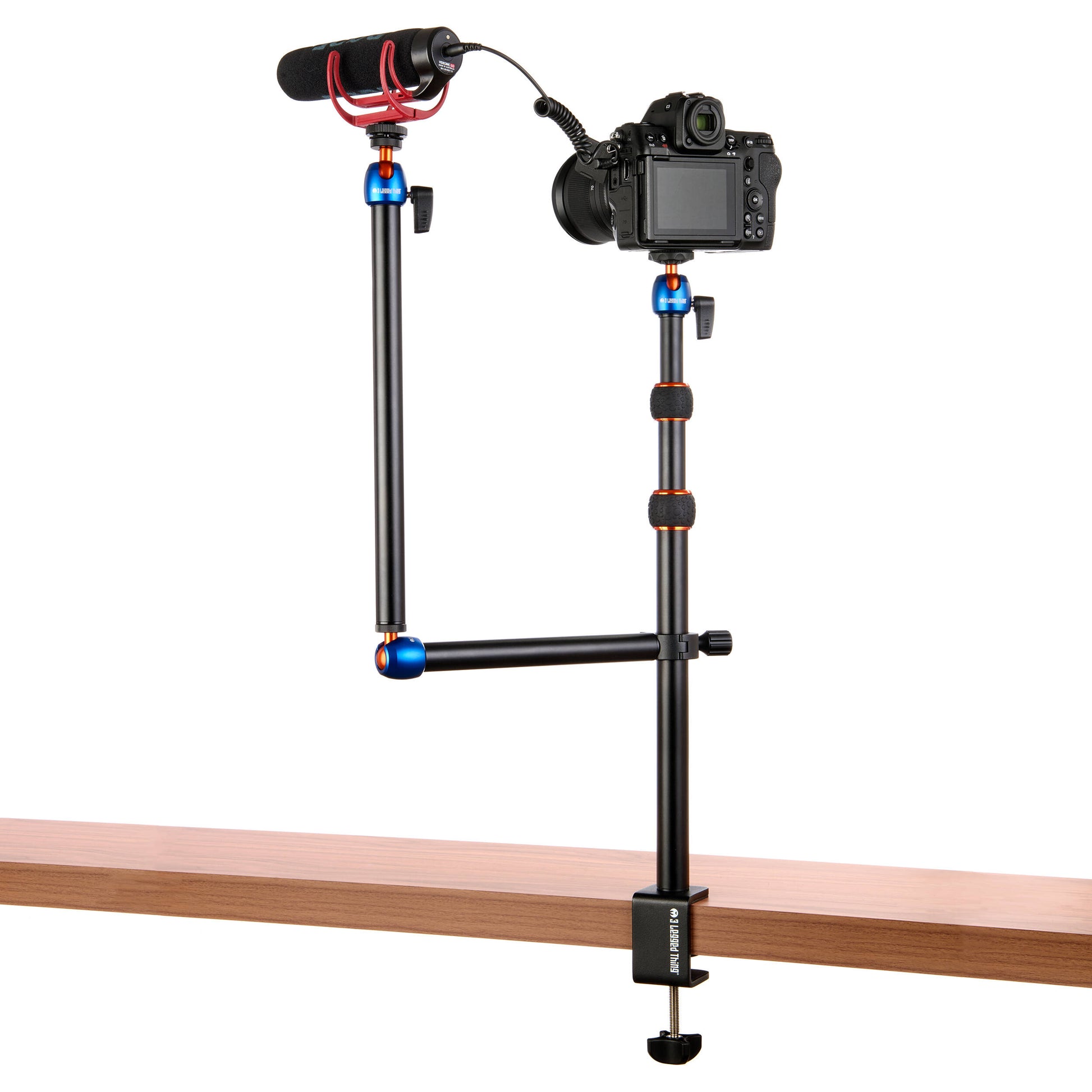 3-Legged-Thing Camera Desk Mount Stand with articulated arm — vertical clamped pole with interconnected horizontal arm and ball-joint extender.