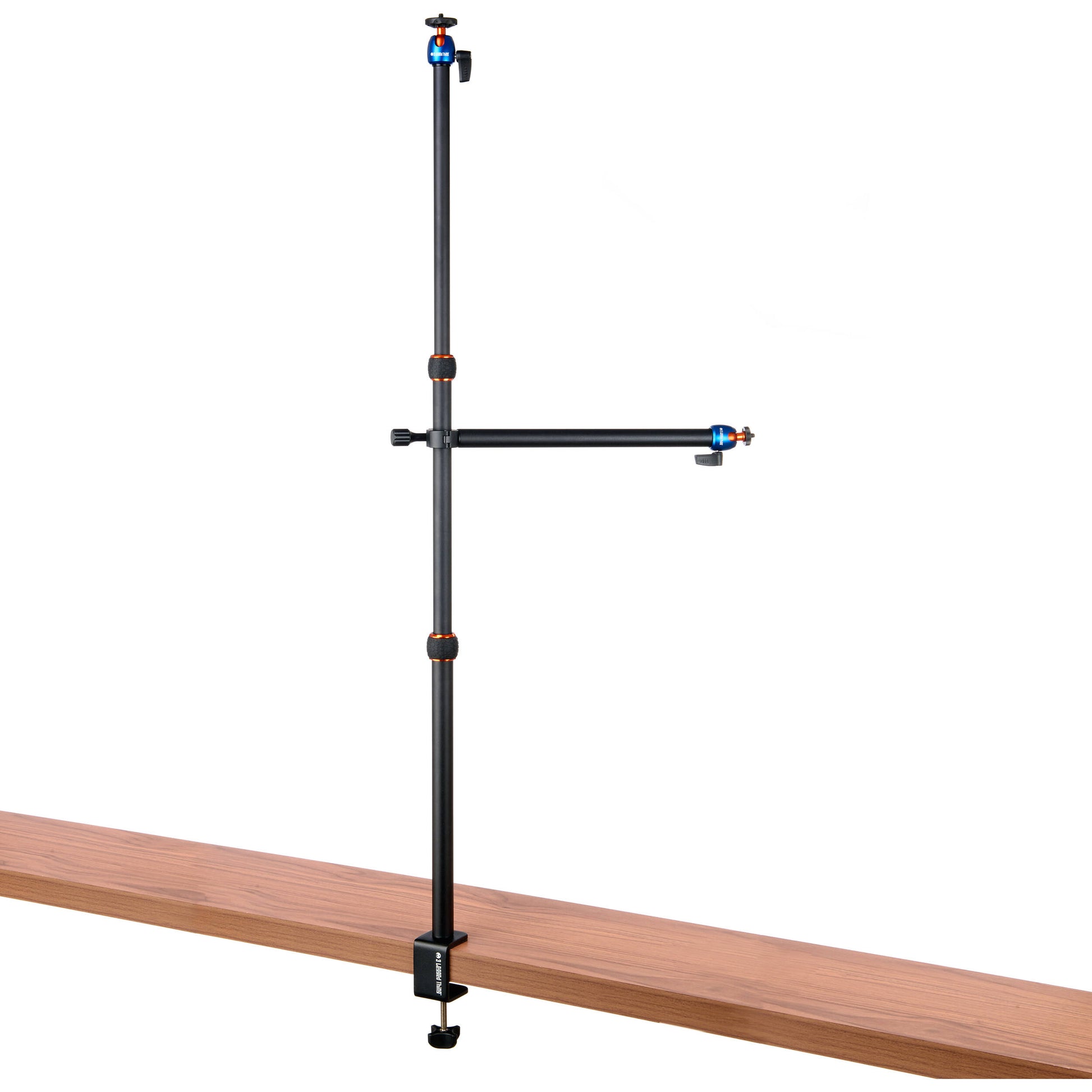 3-Legged-Thing Camera Desk Mount Stand with Auxiliary Arm — table-clamped vertical pole with a horizontal extension arm and additional articulating auxiliary arm with ball heads.