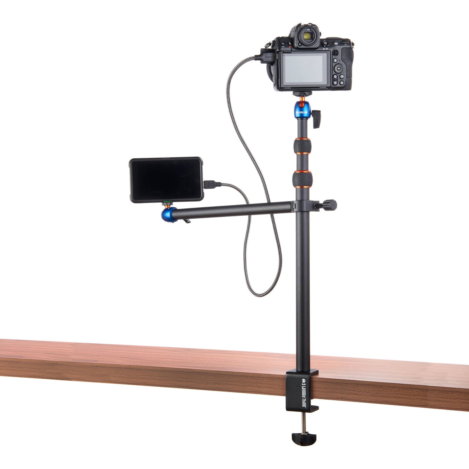 3-Legged-Thing Camera Desk Mount Stand with Auxiliary Arm — table-clamped vertical pole with a horizontal extension arm and additional articulating auxiliary arm with ball heads.