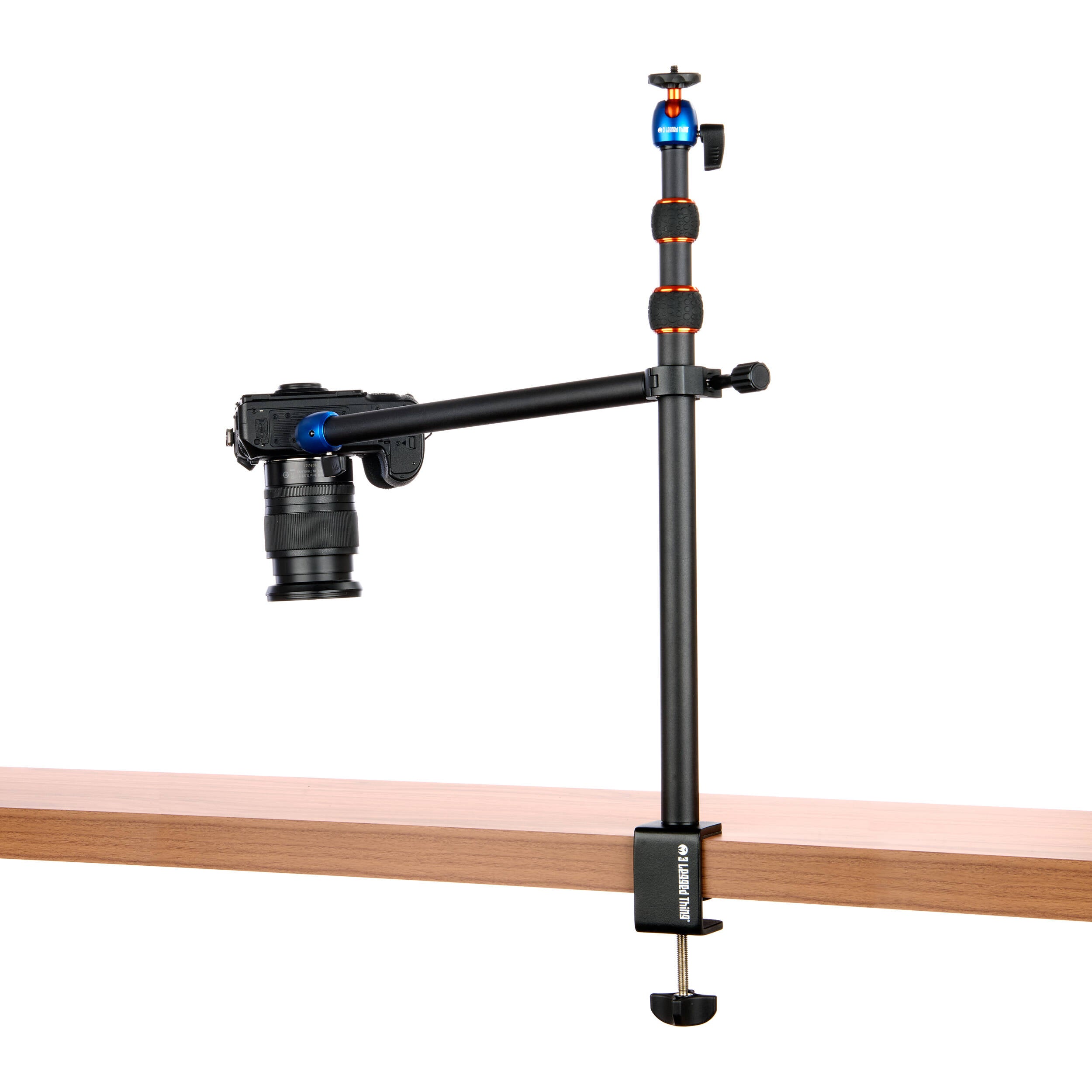3-Legged-Thing Camera Desk Mount Stand with Auxiliary Arm — table-clamped vertical pole with a horizontal extension arm and additional articulating auxiliary arm with ball heads.