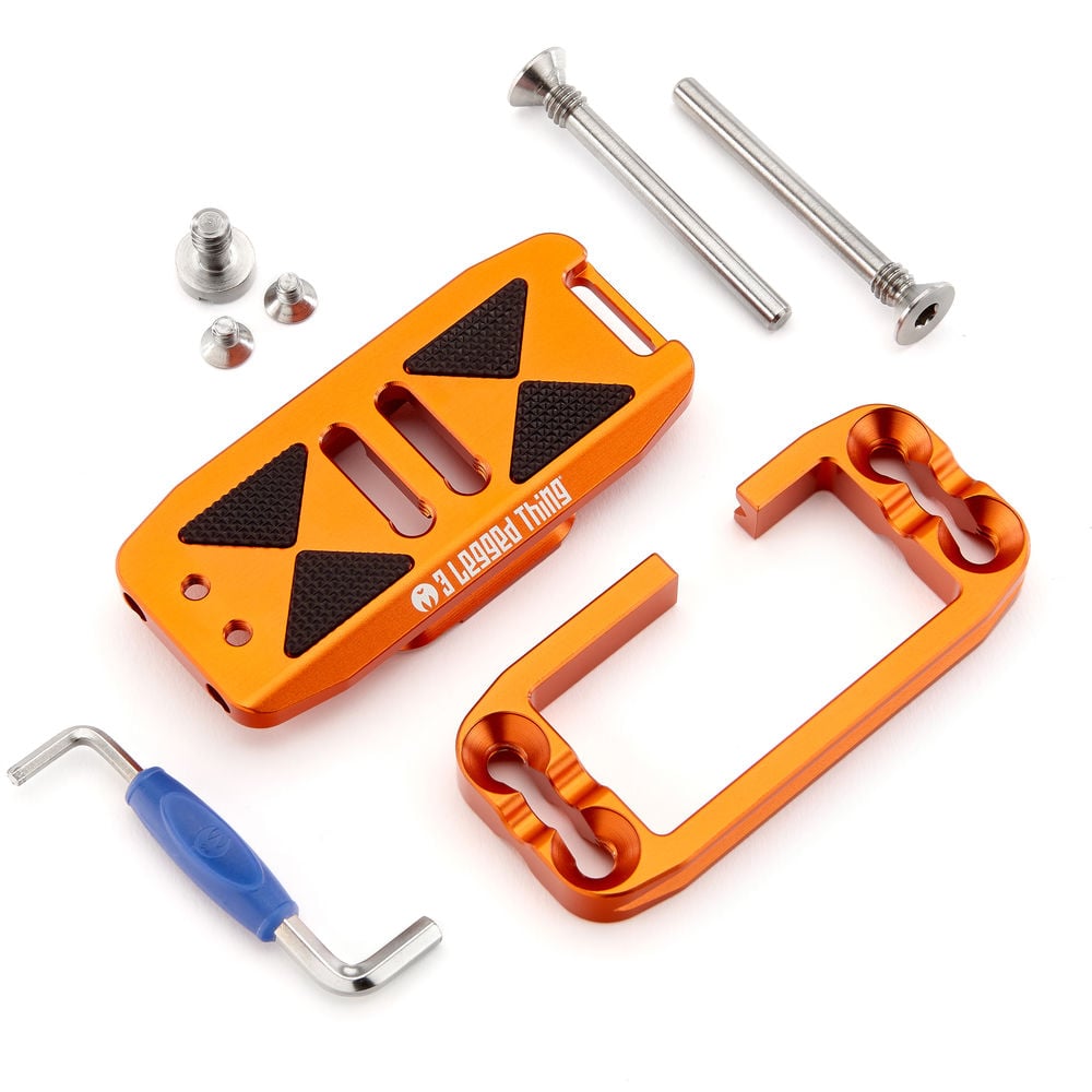 Orange metal tool kit with screws and a blue-handled tool on a white background