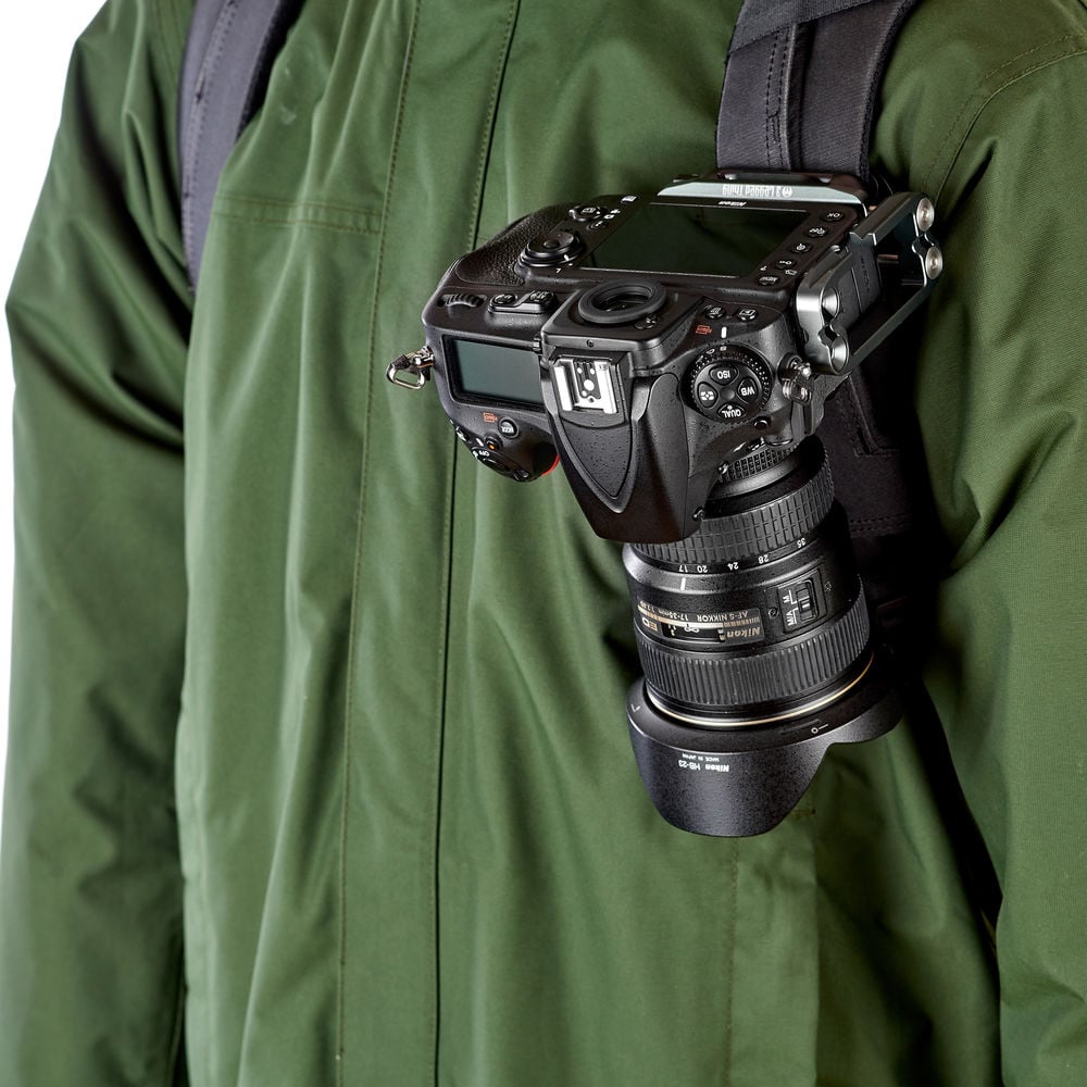 Camera attached to a person wearing a green jacket