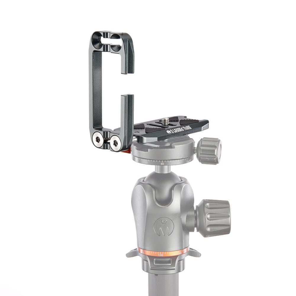 Camera tripod head with quick release plate on a white background