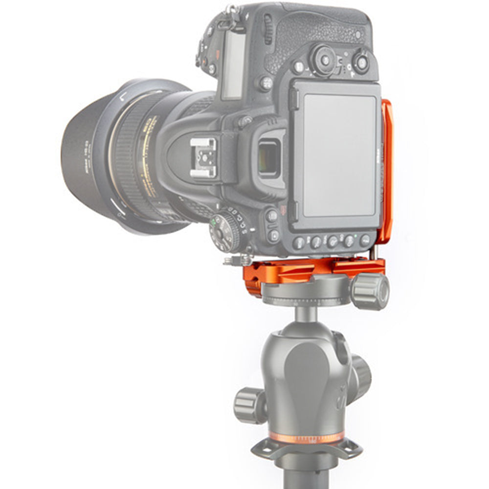 3 Legged Thing Ellie‑C Universal L‑Bracket in copper orange anodised finish, showing adjustable Arca‑type dovetail base with rubber grip pads, stainless steel sliding rods and an upright vertical plate configured for landscape-to-portrait photography.