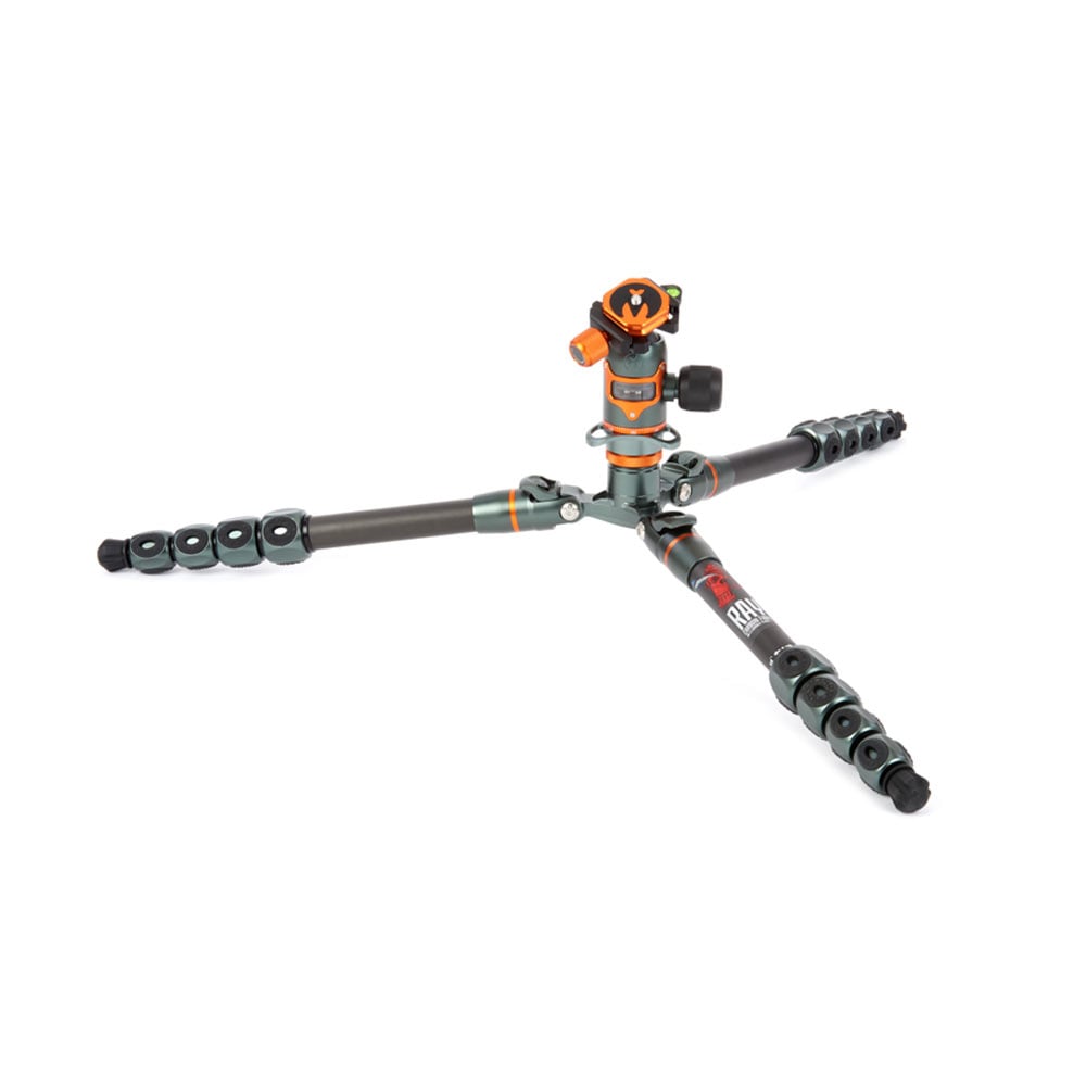 Camera tripod with orange and black head on a white background