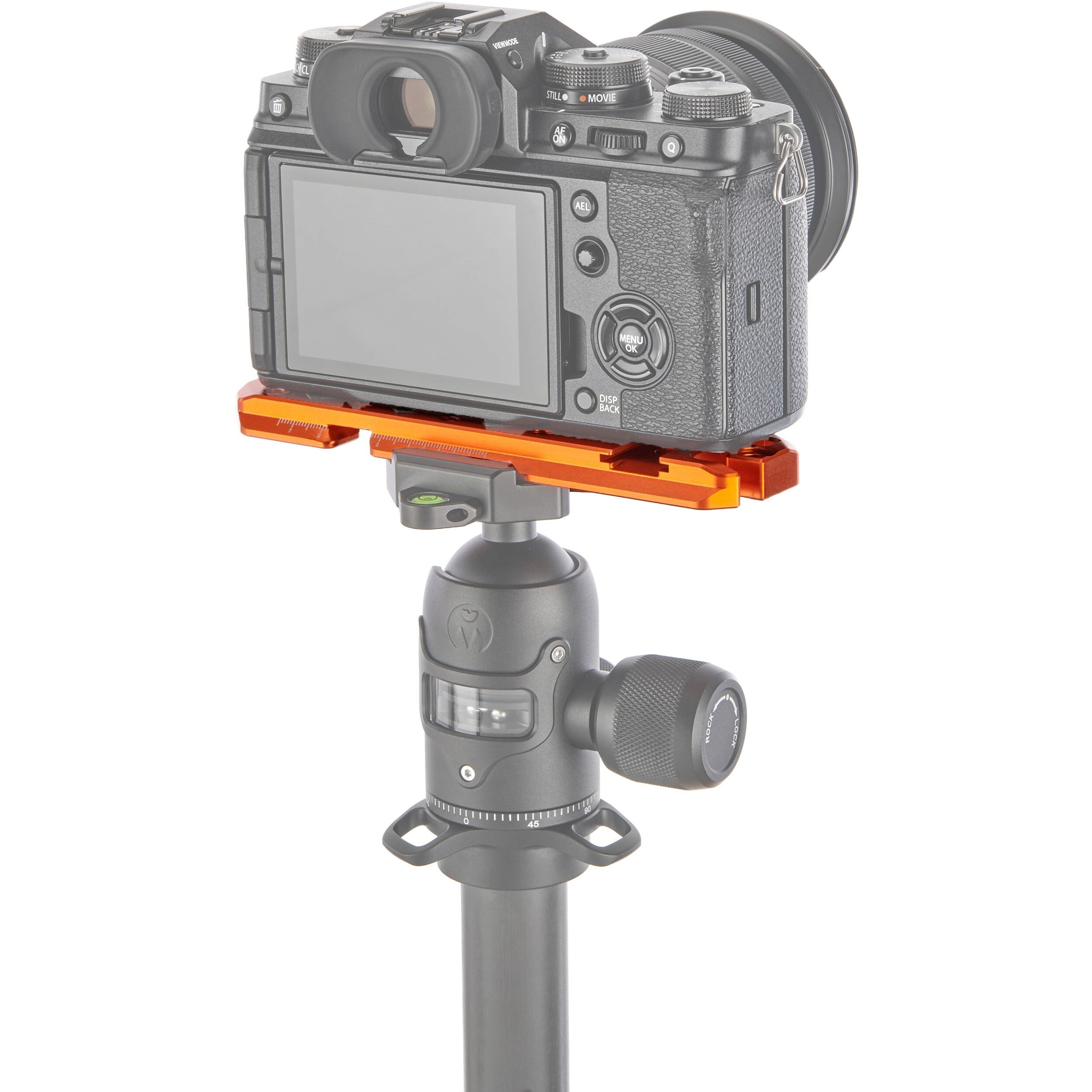 Camera mounted on a tripod with an orange plate on a white background