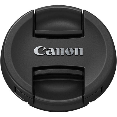 Black Canon lens cap on a white background