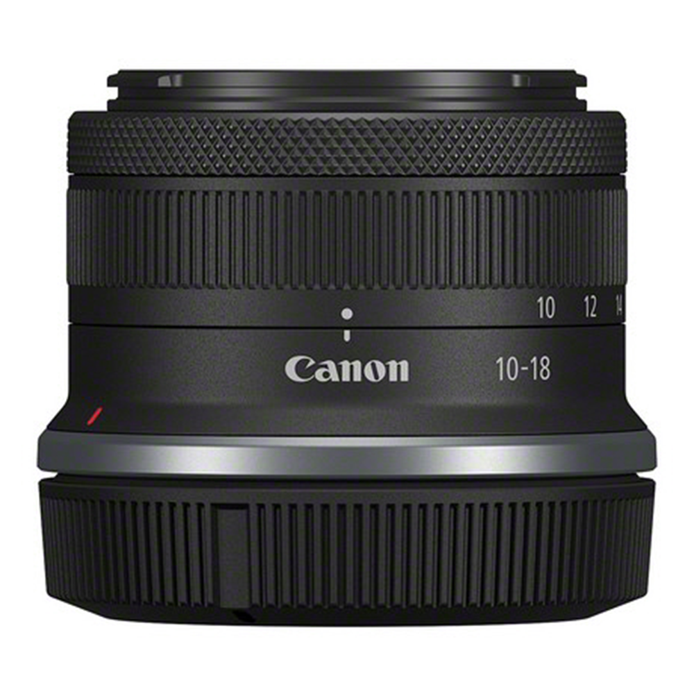 Canon camera lens with focus scale on a white background