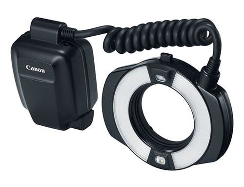 Canon ring light with black housing and coiled cable on a white background