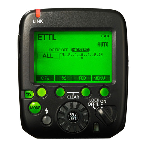 Black speedlite transmitter with control panel on a white background