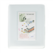 White photo album with Instax Mini camera and van design on a white background