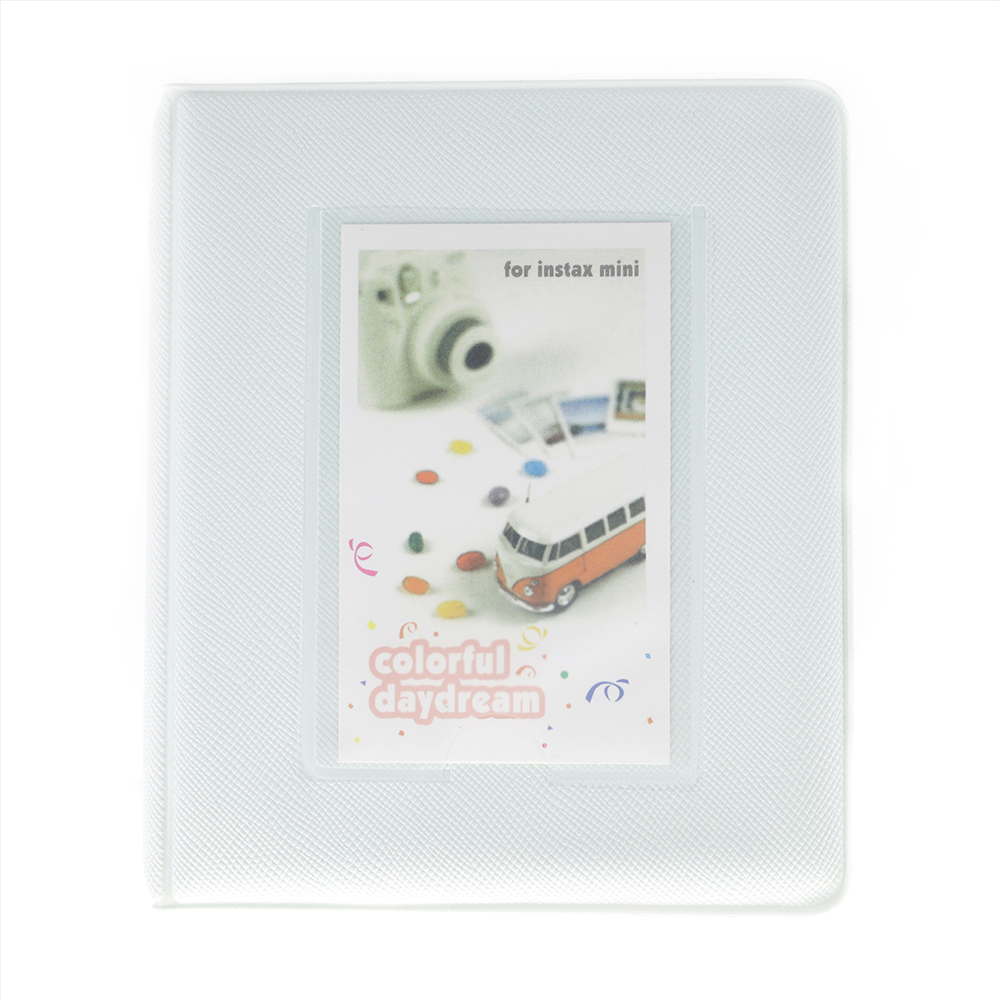 White photo album with Instax Mini camera and van design on a white background