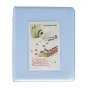 Light blue case for Instax Mini with colorful daydream design on a white background