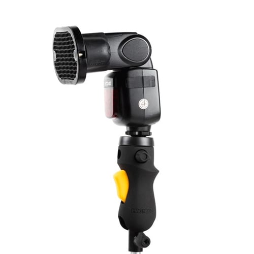 MagMod MagShoe 2 universal cold-shoe bracket with ergonomic pistol-style grip and orange release lever for one-handed flash or modifier mounting.