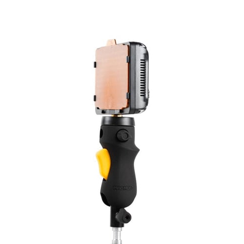 MagMod MagShoe 2 universal cold-shoe bracket with ergonomic pistol-style grip and orange release lever for one-handed flash or modifier mounting.