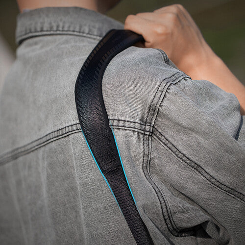 PGYTECH Camera Strap in Night Black with quick-release buckles, padded shoulder support, and adjustable design for DSLR and mirrorless cameras.