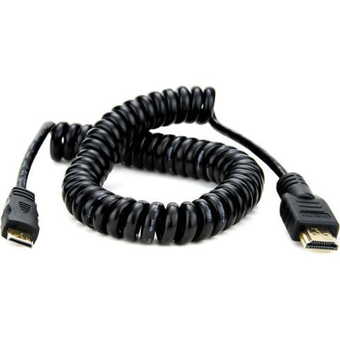 Coiled HDMI cable on a white background
