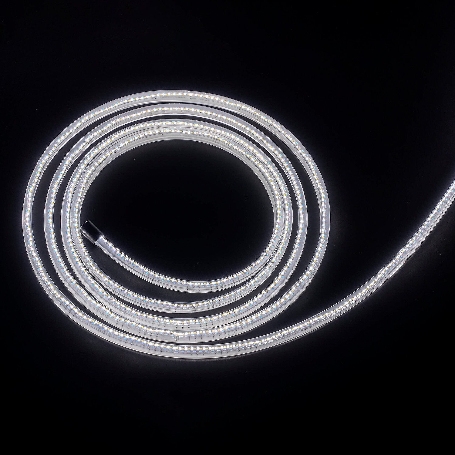 Coiled LED light strip on a black background