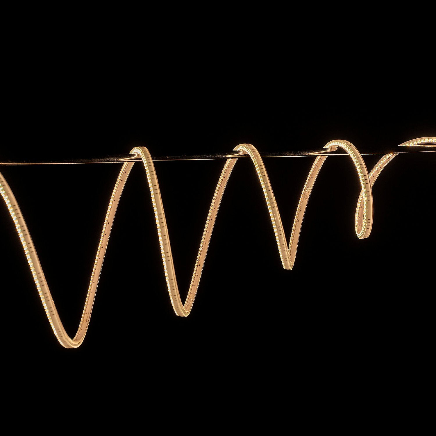 Yellow LED strip light on a black background