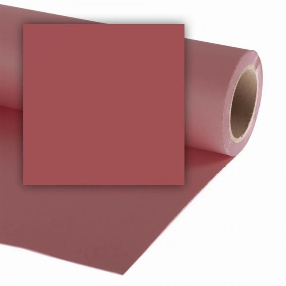 Roll of red paper with a square piece cut from it on a white background