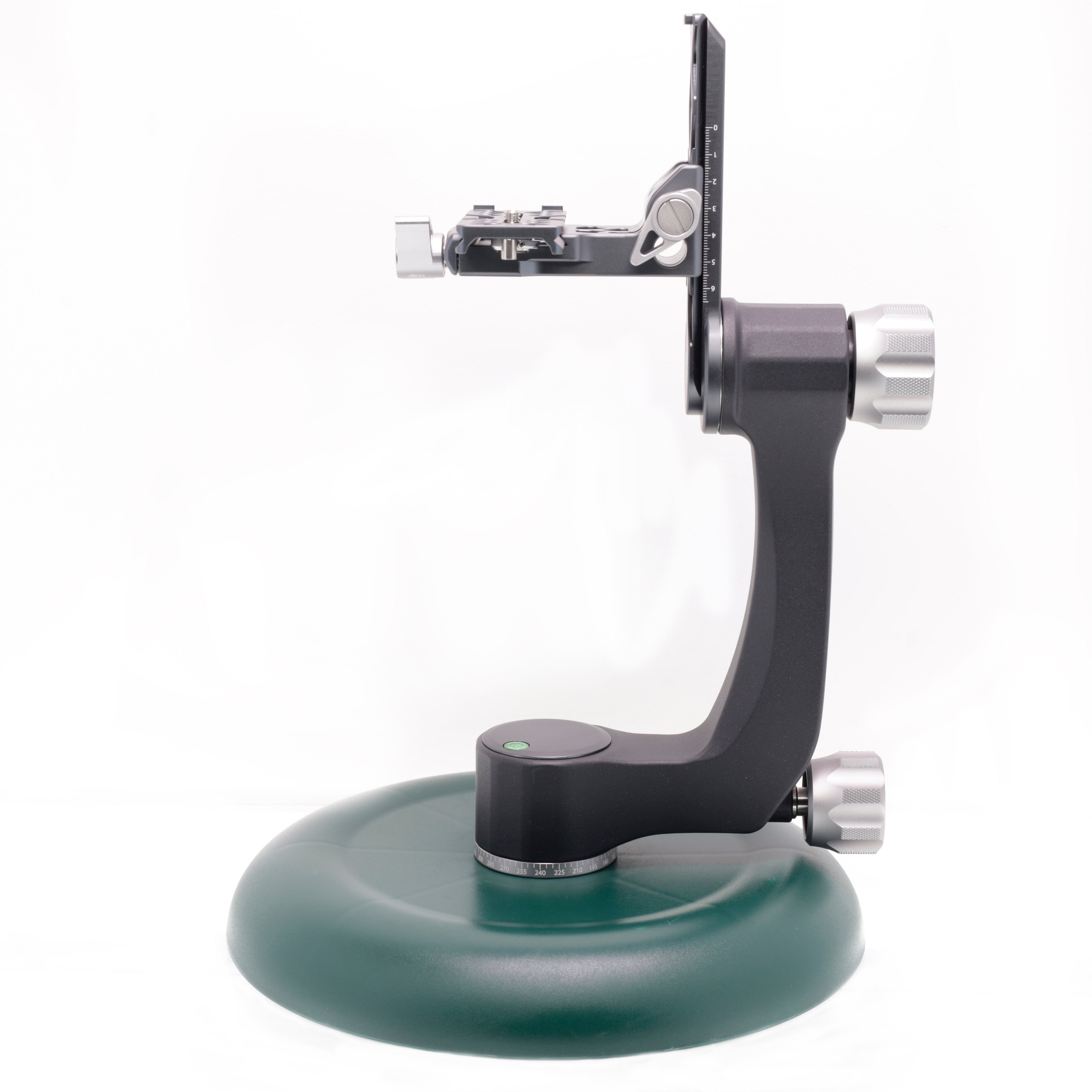 Badger Gear Ground Pod in green and black, a low-profile round camera support platform with a star‑spoke base and a central ⅜″ mounting screw; shown from top, side and angled views with adjustable pod attachment, designed for stable ground‑level or bean‑bag photography.