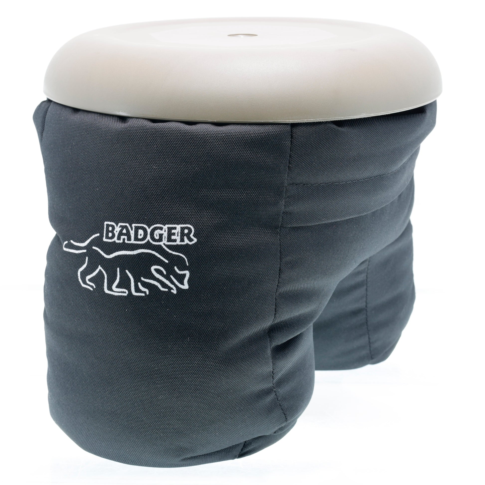 Badger Gear Ground Pod in khaki with black accents, showing adjustable tripod-style legs with spiked feet and a swiveling platform for mounting cameras or lenses at low angles on terrain.