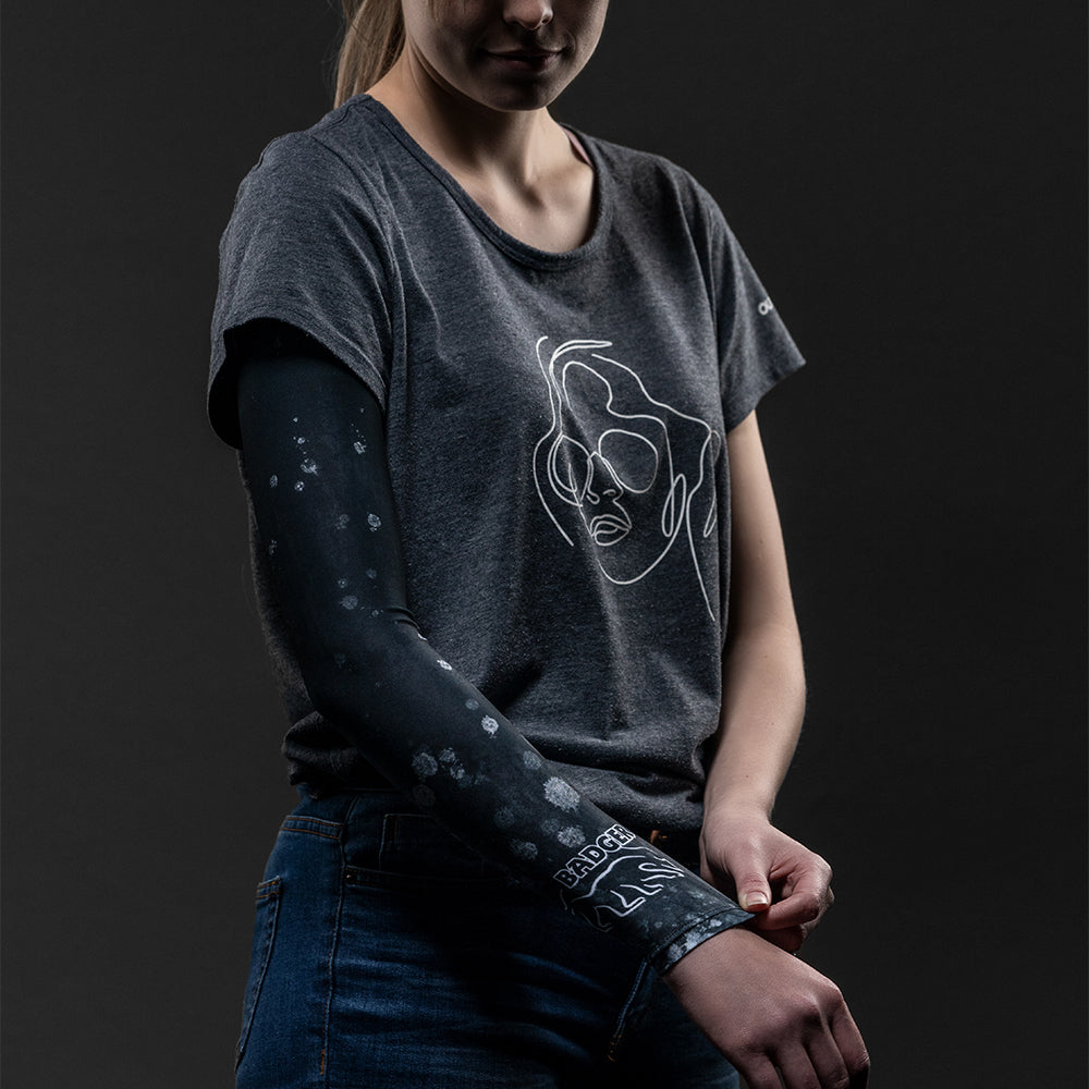 A stay-up arm sleeve in black that will cover and protect your arm from harmful sun rays and provide an extra warming layer of protection in colder weather.