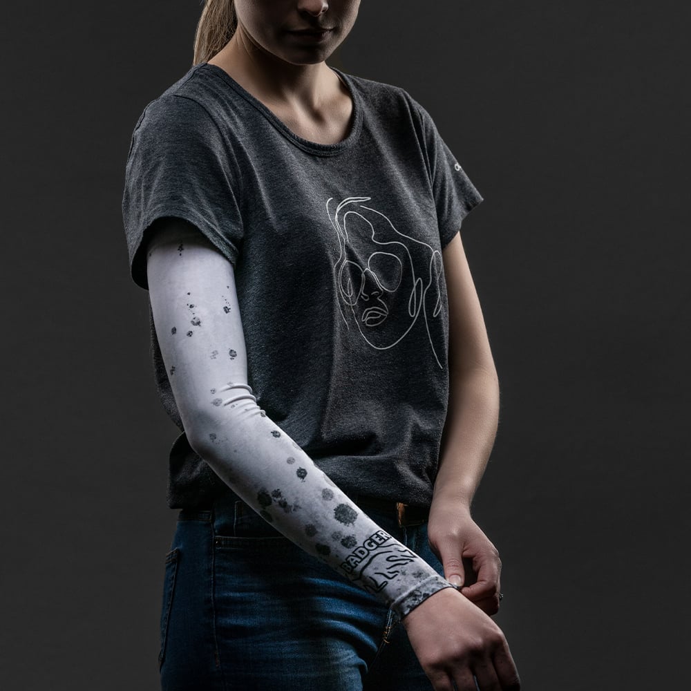 A cool white arm sleeve that will cover and protect your arm from harmful sun rays and provide an extra warming layer of protection in colder weather.