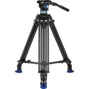 Black video tripod with a head on a white background
