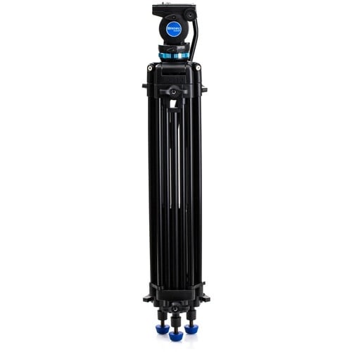 Benro KH25P video tripod in black with fluid video head attached, featuring three-section adjustable legs with flip locks, integrated mid-level spreader, retractable spiked rubber feet, ergonomic fluid pan‑tilt head with control arms, quick‑release camera plate, and built-in bubble level.