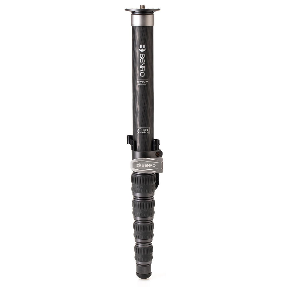 Benro SupaDupa carbon-fiber monopod with integrated pan‑tilt head, twist‑lock sections and spiked/rubber rotating foot.