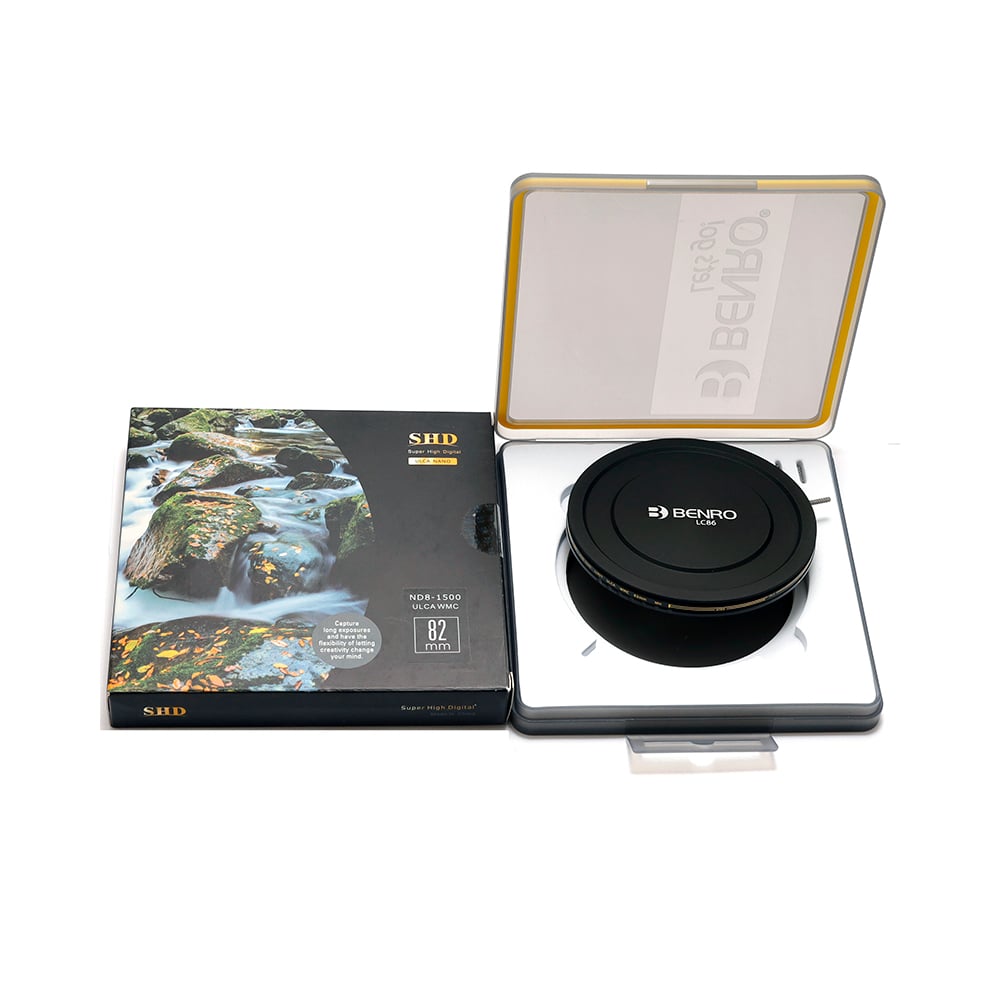 Black photography accessory with open packaging on a white background