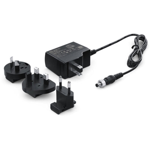 Blackmagic Design Power Supply with black rectangular adapter and attached cable, designed for powering compatible Blackmagic devices.