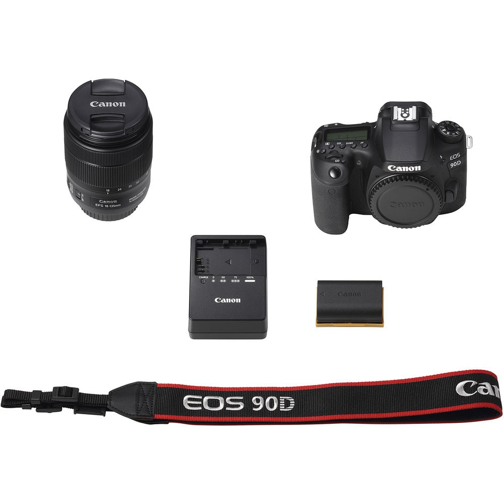 Canon camera set with lens, battery, charger, and strap on a white background