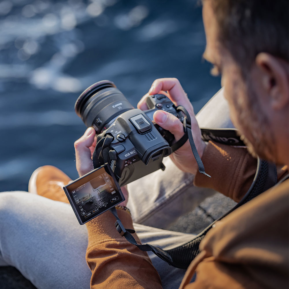 Canon EOS R5 C Mirrorless Camera: 45MP full-frame sensor, 8K 60p video, DIGIC X processor, RF mount, Dual Pixel CMOS AF II, 20fps shooting, 5-axis IS, OLED EVF, active cooling, professional recording formats.