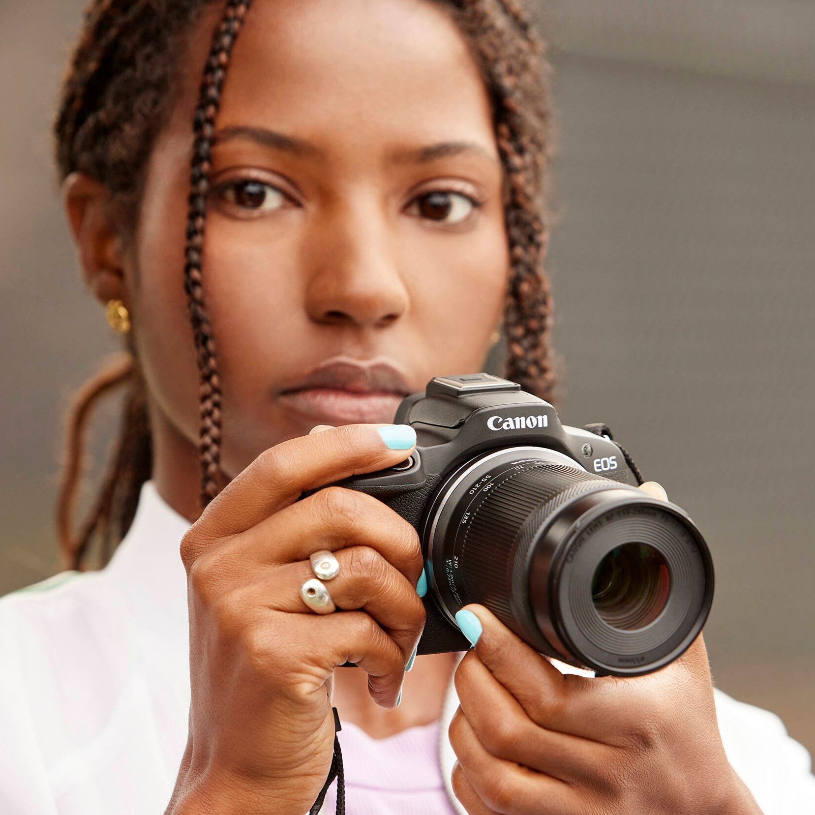 Canon EOS R50 with 18-45mm and 55-210mm lenses and vari-angle touchscreen.