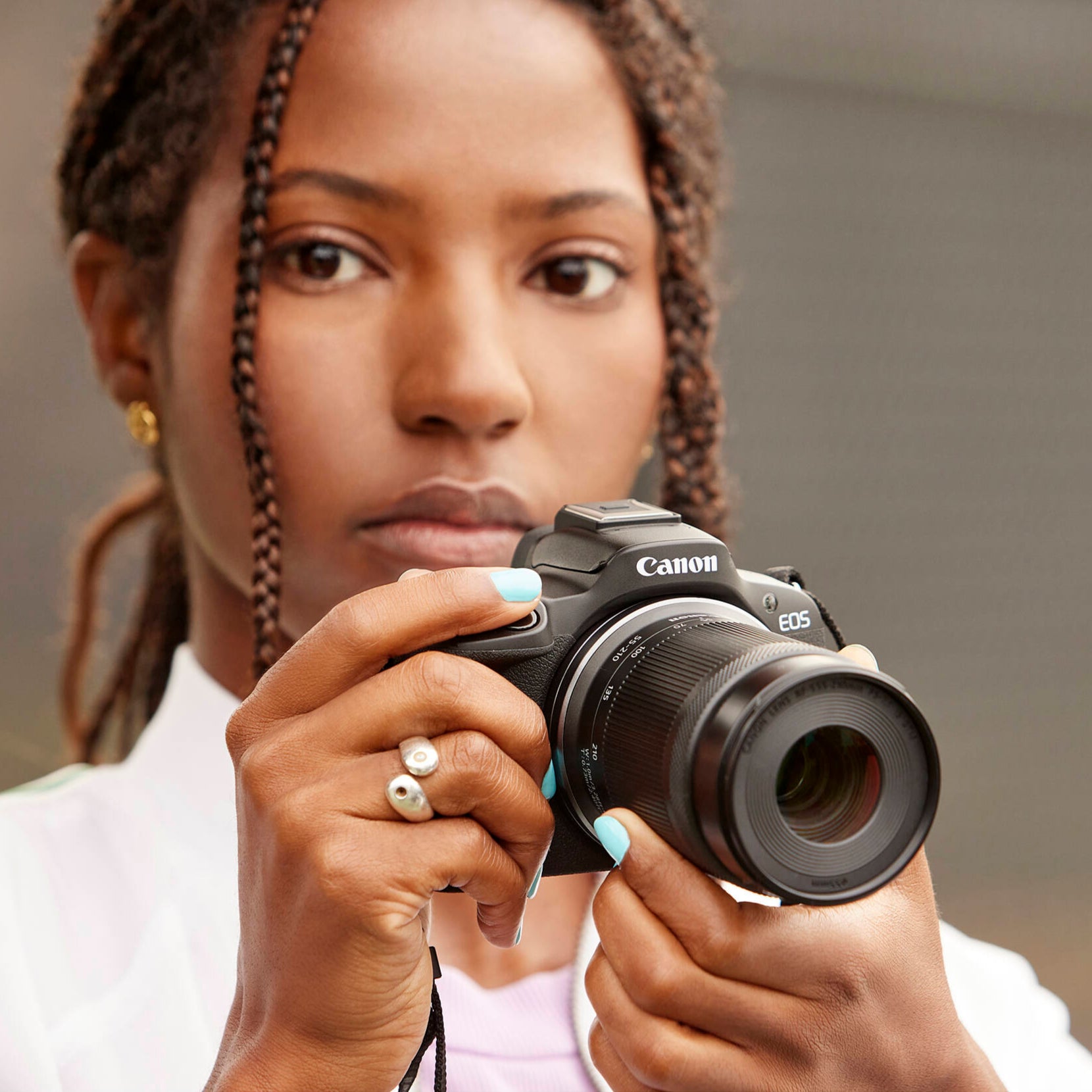 Canon EOS R50 mirrorless camera with 24MP sensor and 4K video.