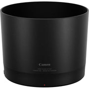Black Canon lens hood on a white background