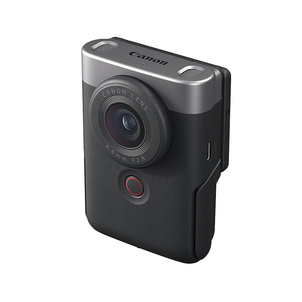 Canon PowerShot V10 Advanced Vlogging Kit (Silver): Compact 15MP 1" BSI CMOS sensor, fixed 19mm wide-angle lens, UHD 4K30p and Full HD 60p video, dual built-in stereo mics with wind filter, enhanced image stabilization, 2" tilting touchscreen, built-in stand, Wi-Fi & Bluetooth, camera cage kit included for accessory mounting and wind noise reduction.