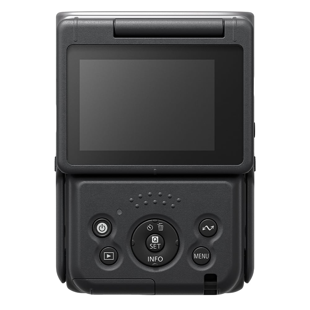 Canon PowerShot V10 Vlog Camera in black, compact rectangular body with wide-angle lens, tilting flip-up screen, and built-in stand.