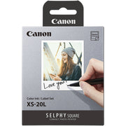 Canon Selphy Square photo printer ink cartridge packaging with a hand writing 'Love you!' on a photo.