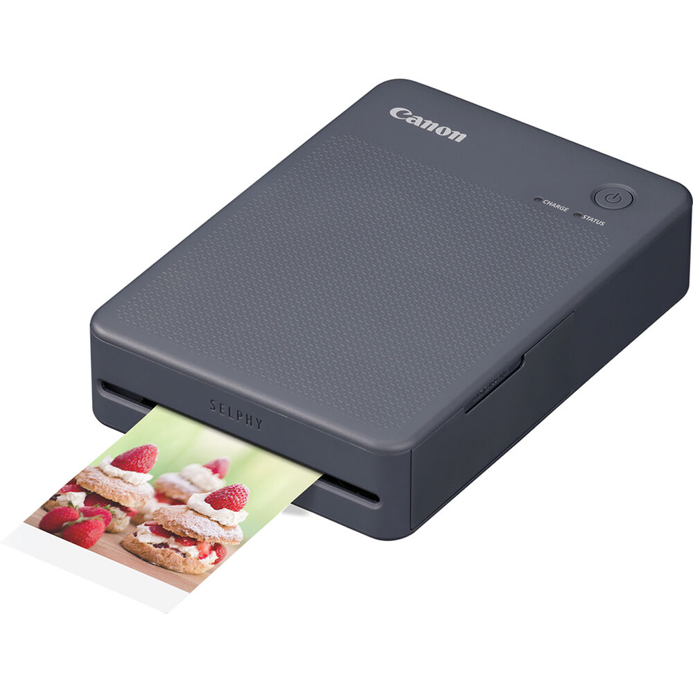 Canon Selphy Square QX20: Portable dye sublimation photo printer with 287x287 dpi resolution, supports square (72x85mm) and card-size (54x85mm) sticker paper, prints fade-resistant photos lasting up to 100 years, built-in lithium battery with approx. 40-sec print speed, Wi-Fi connectivity, USB-C charging, controlled via SELPHY Photo Layout app.